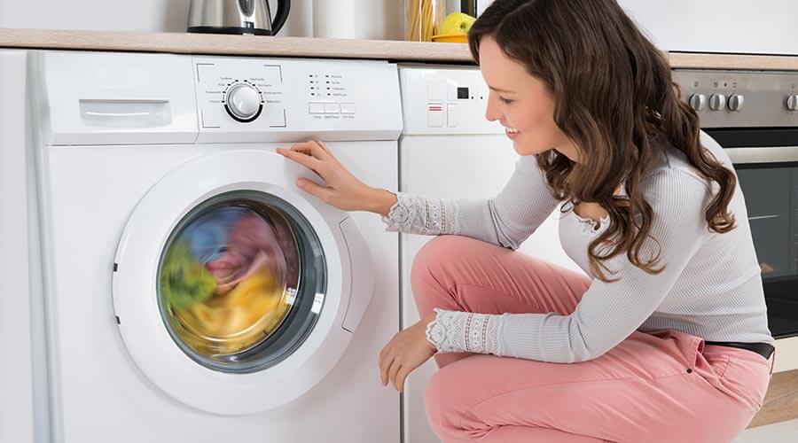 Woman washing load of laundry