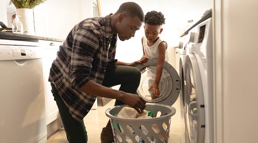 Father and son sorting laundry